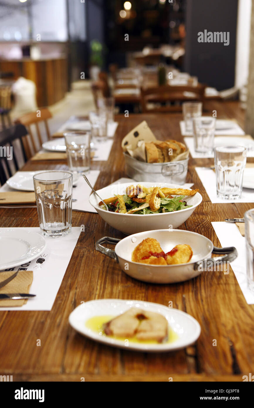 Spicy lakerda. Cheese pies. Green salad, Bread at Ergon restaurant and delicatessen, Thessaloniki, Greece Stock Photo