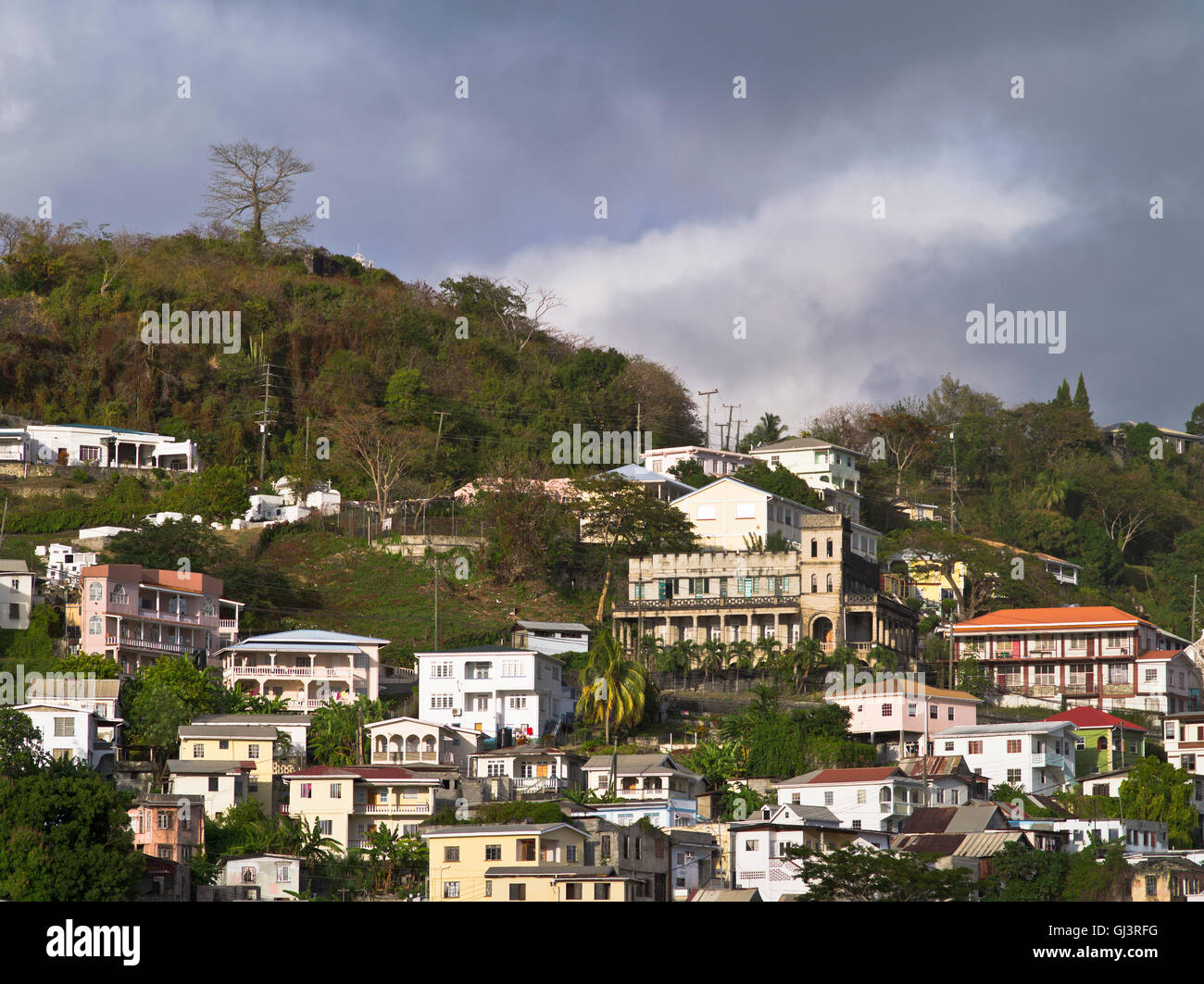 dh St George GRENADA CARIBBEAN Caribbean houses on hillside stormy clouds Stock Photo