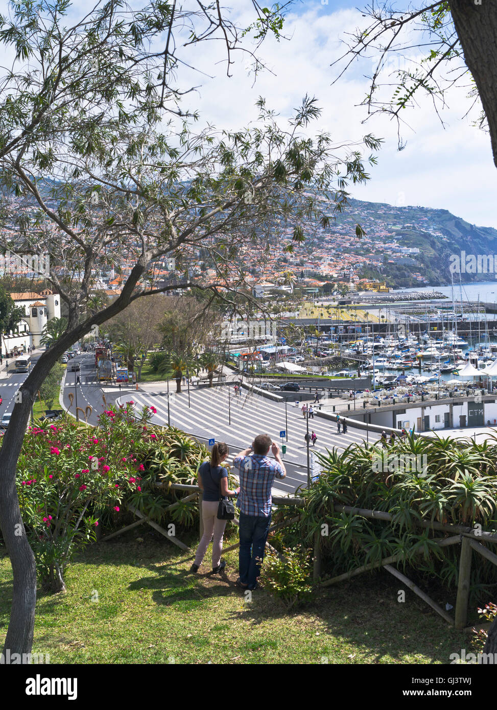 dh St Catarina Park FUNCHAL MADEIRA Couple photographing Funchal marina harbour from viewpoint tourist Santa Catarinas Stock Photo