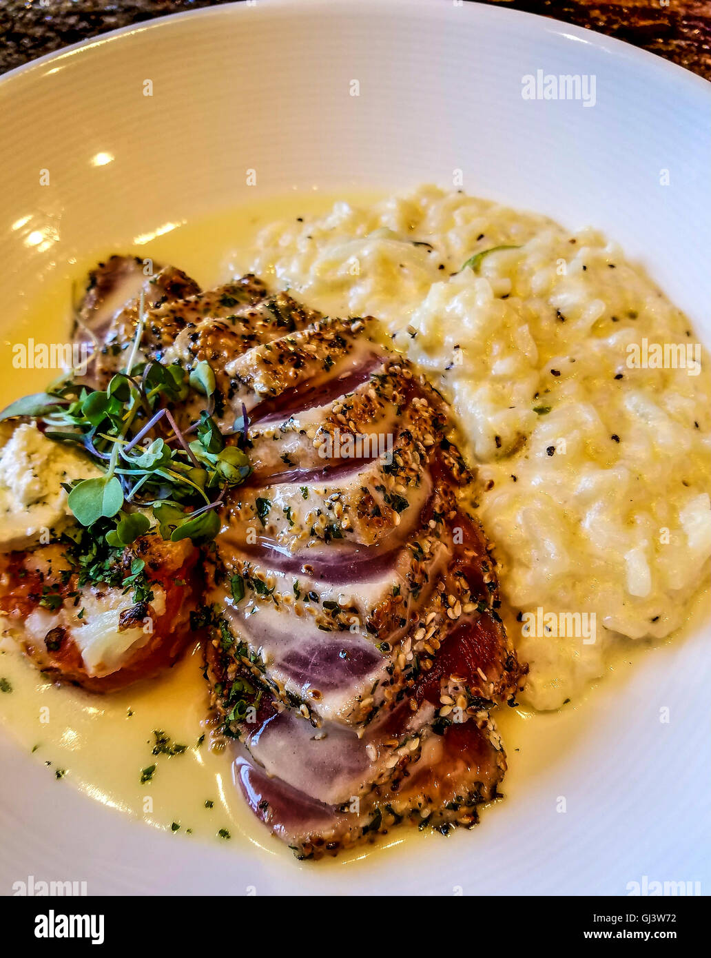 Sesame crusted tuna at Golden Nugget's Country Club, along with yummy risotto. Stock Photo