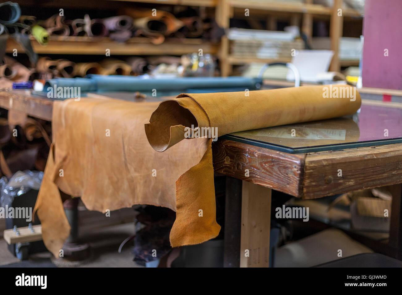 Outstretched leather awaits bookbinder for cutting and dye Stock Photo
