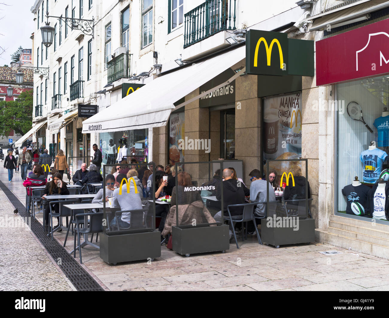 dh mcdonalds restaurant LISBON PORTUGAL McDonalds outdoor cafe Green Yellow logo eat sidewalks street eating food abroad Stock Photo