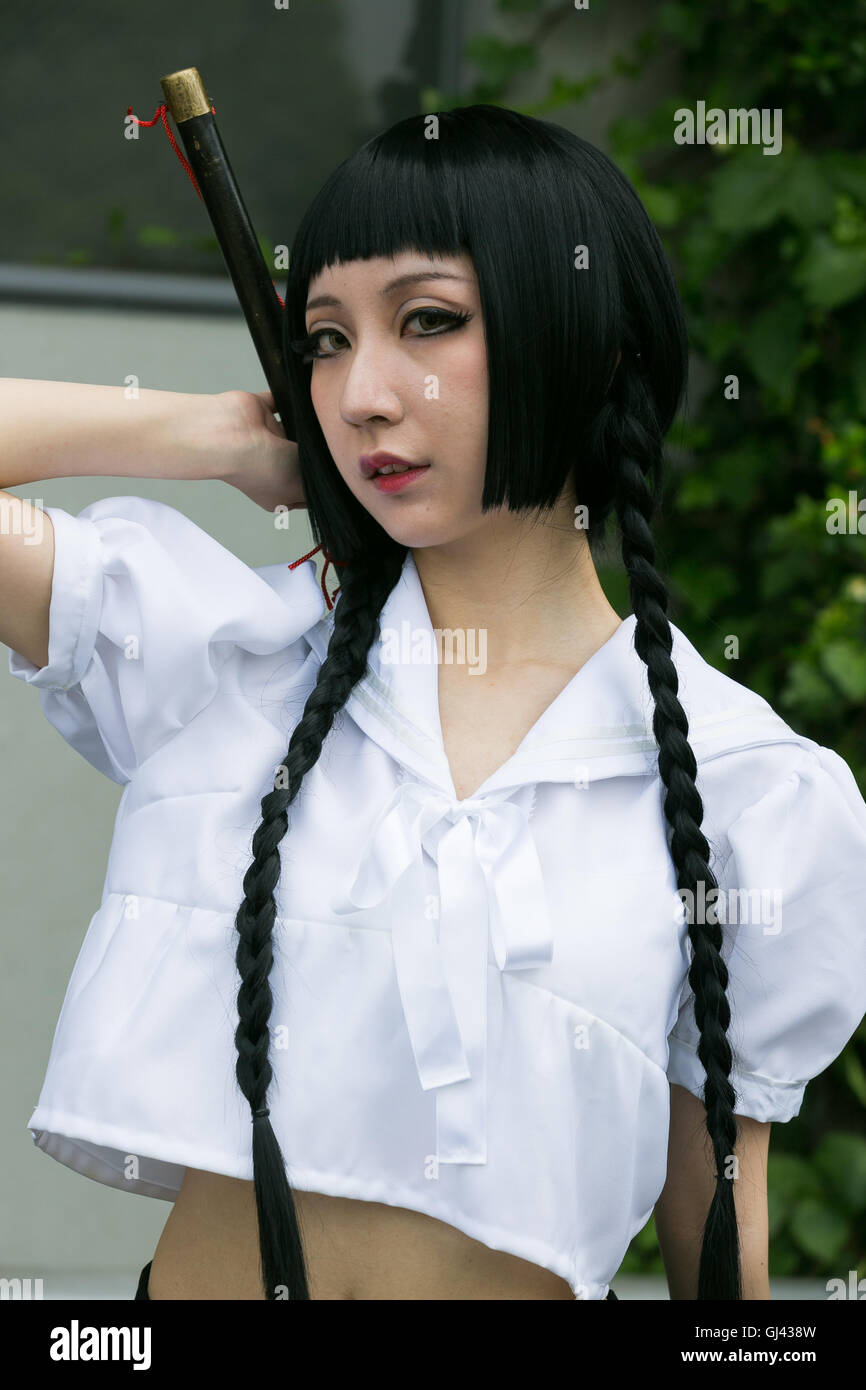 Tokyo, Japan. 12th August, 2016. A cosplayer poses for a photograph ...