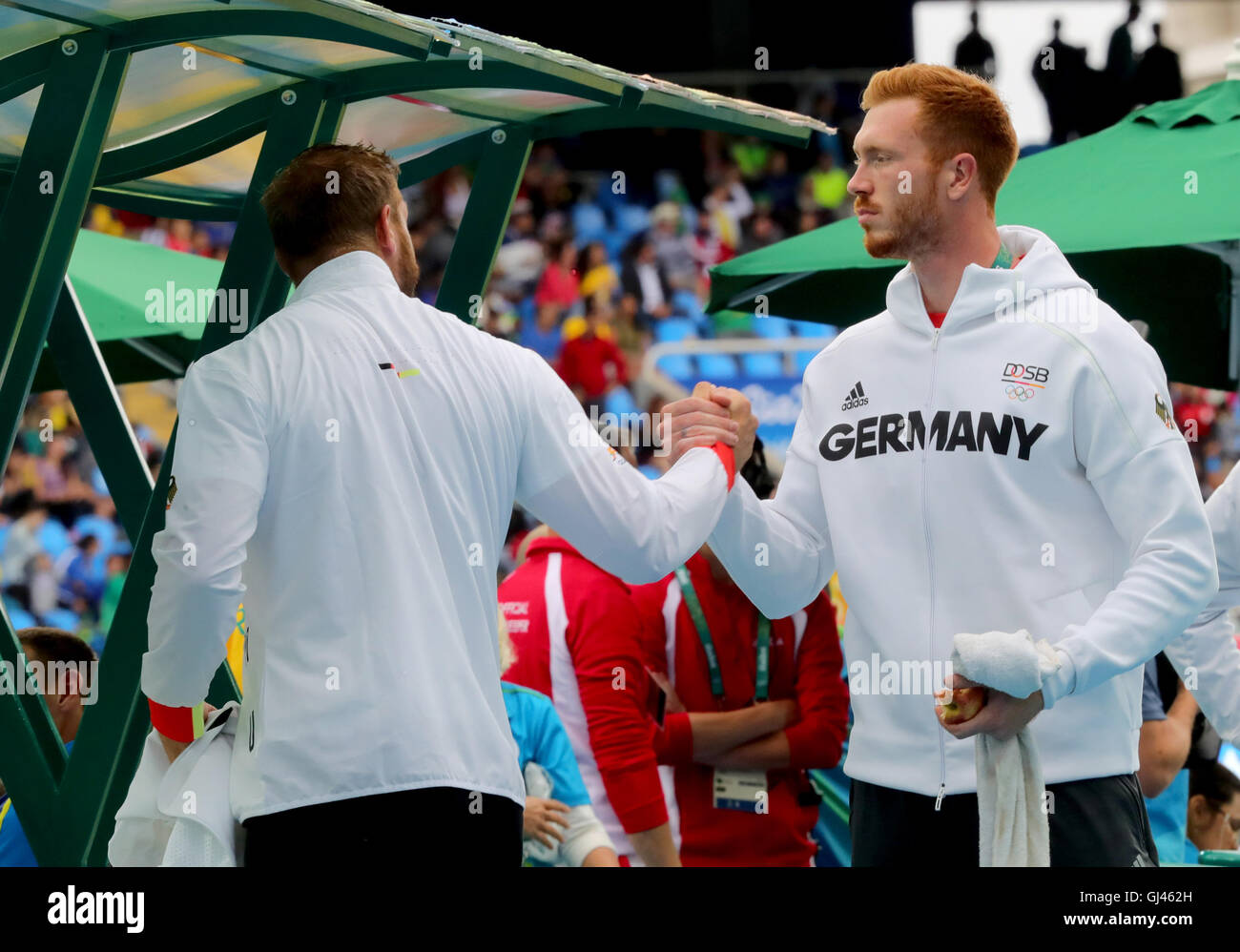 Rio de Janeiro, Brazil. 12th Aug, 2016. Robert (L) and Cristoph Harting of Germany compete in