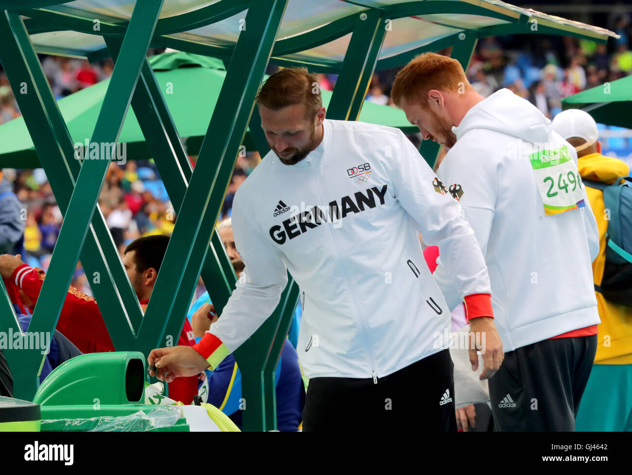 Rio de Janeiro, Brazil. 12th Aug, 2016. Robert (L) and Cristoph Harting of Germany compete in