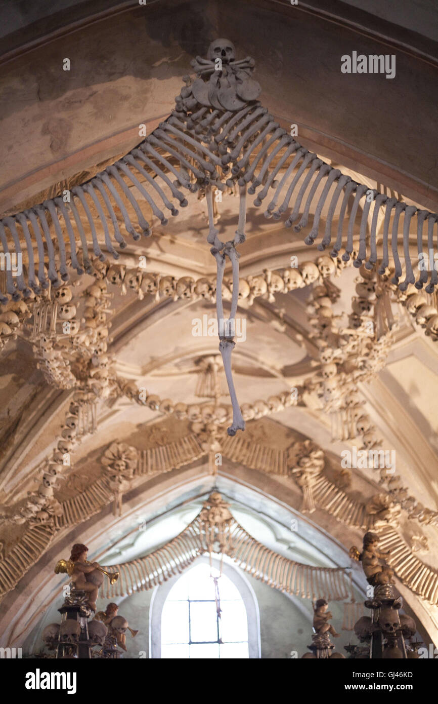 July 30, 2016 - Kutna Hora, Czech Republic - The Sedlec Ossuary ''Bone Church''.The Sedlec Ossuary is a small Roman Catholic chapel, located beneath the Cemetery Church of All Saints in Sedlec, a suburb of KutnÃ¡ Hora in the Czech Republic that displays some of the worldâ€™s more macabre art. It is one of twelve World Heritage Sites in the Czech Republic. The ossuary is estimated to contain the skeletons of between 40,000 and 70,000 people, whose bones have been artistically arranged to form decorations and furnishings for the chapel. The ossuary is among the most visited tourist attractions o Stock Photo