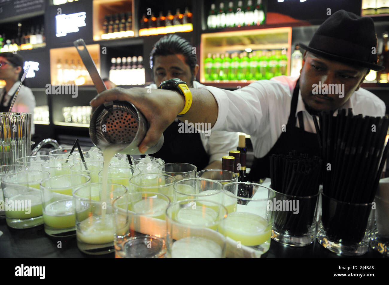 Singapore. 12th Aug, 2016. A bartender makes cocktails at the Epicurean Market held at Singapore's Marina Bay Sands Expo, Aug. 12, 2016. The 4th Epicurean Market is being held from Aug. 12 to 14 at the Marina Bay Sands Expo. © Then Chih Wey/Xinhua/Alamy Live News Stock Photo