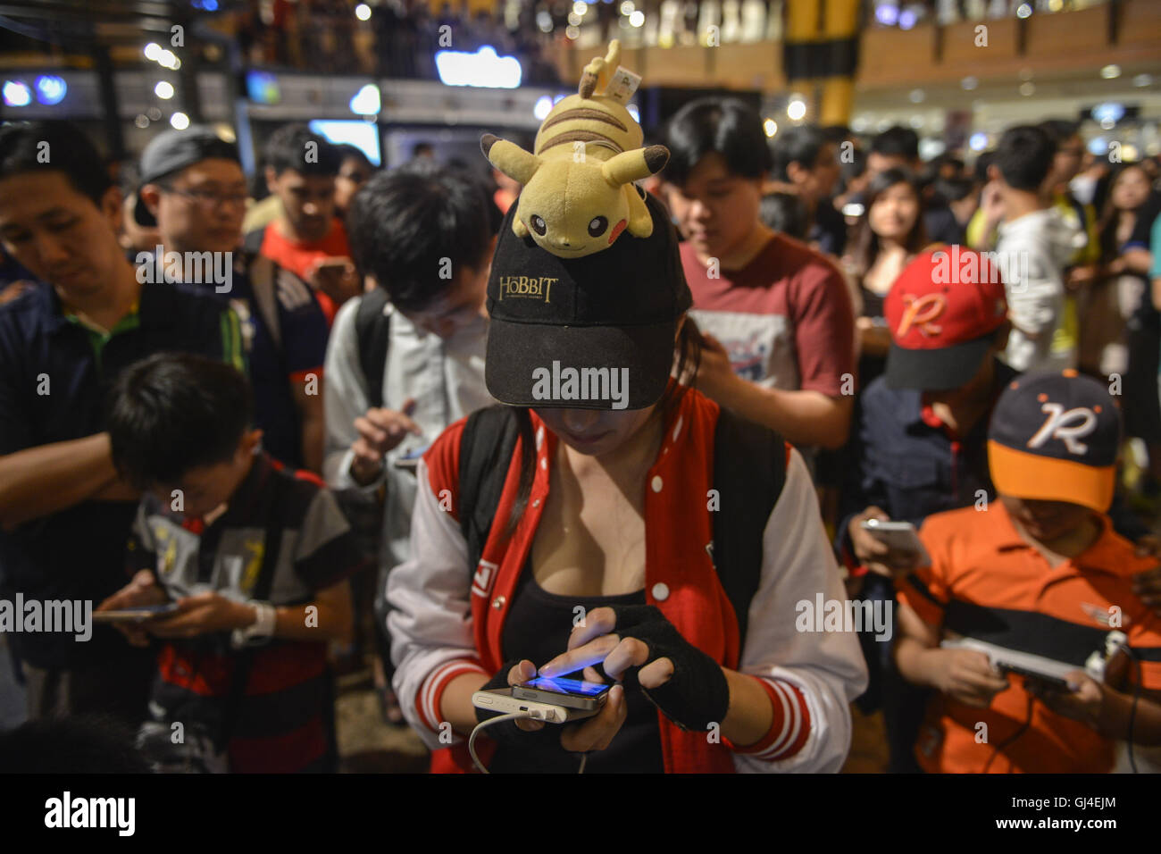 Sunway Selangor Malaysia 13th Aug 16 People Play Pokemon Go On Their Smartphones During Pokemon Costume Contest At Sunway Pyramid Shopping Mall Outside Kuala Lumpur Players Use A Mobile Device S Gps Capability