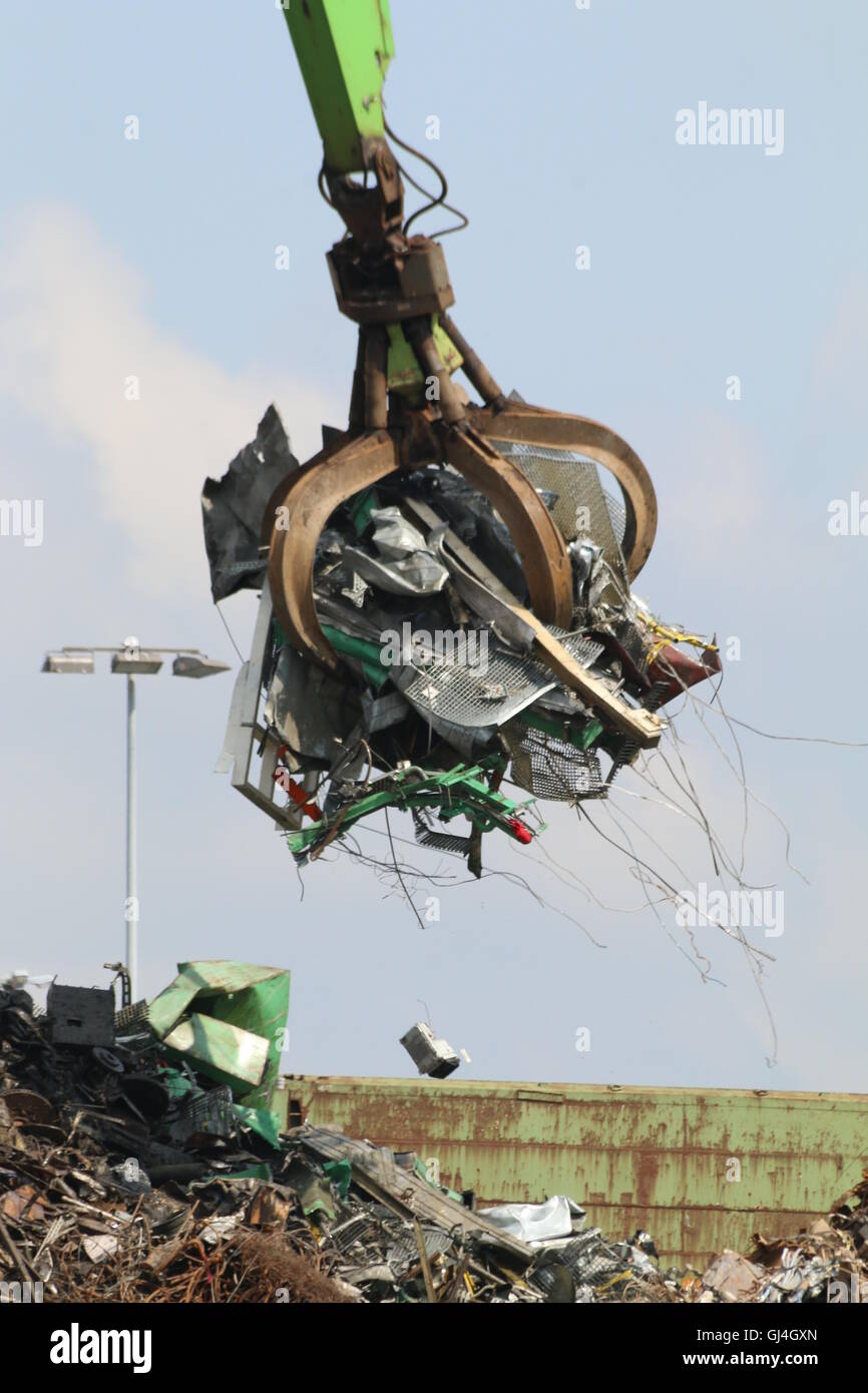 Crane with grab claw at scrap metal recycling yard, Hamburg Stock Photo