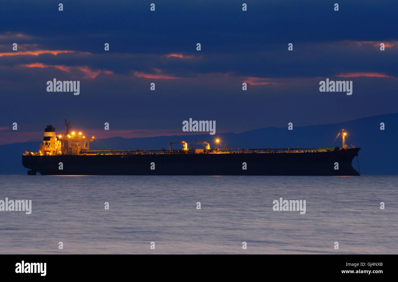 Commercial ship at dusk Stock Photo