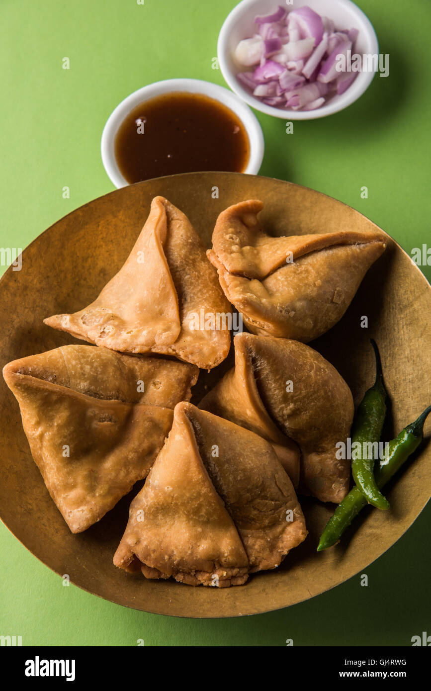Veg potato Samosa with sauces, Homemade Fried Indian Samosa with Mint