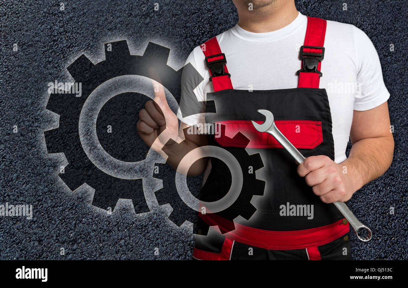 Gears touchscreen is operated by mechanic. Stock Photo