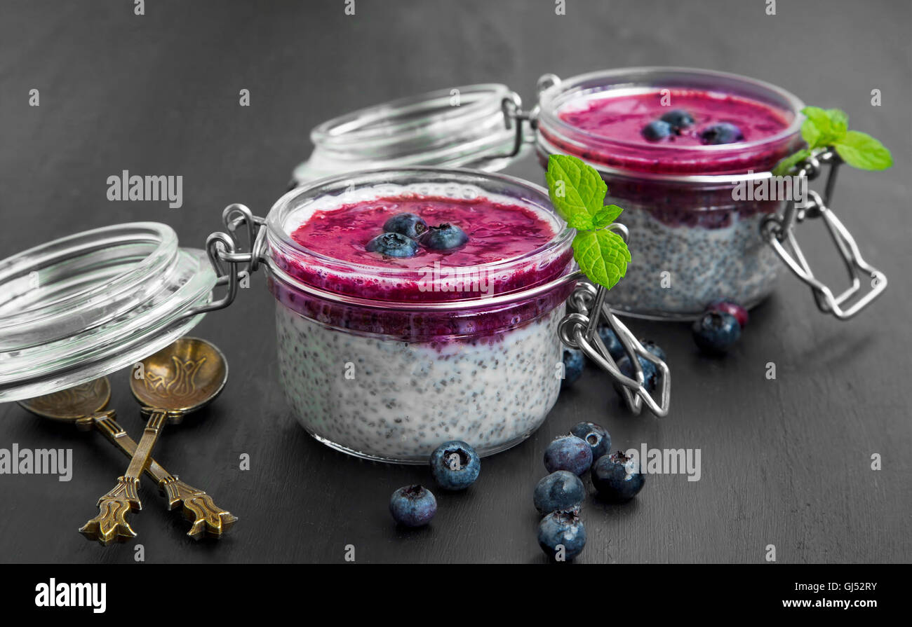 Fresh chia pudding desserts with blueberry topping and mint Stock Photo