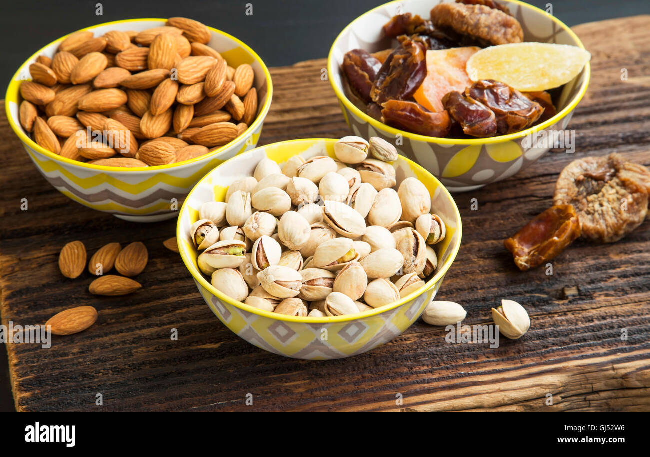 Mix of dried fruits, candied fruits with pistachio and almond nuts Stock Photo