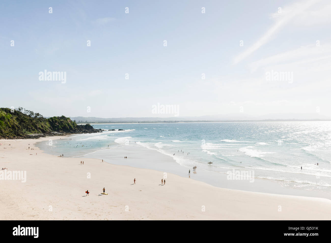 People bathing and surfing at Wategos Beach in Byron Bay. Stock Photo
