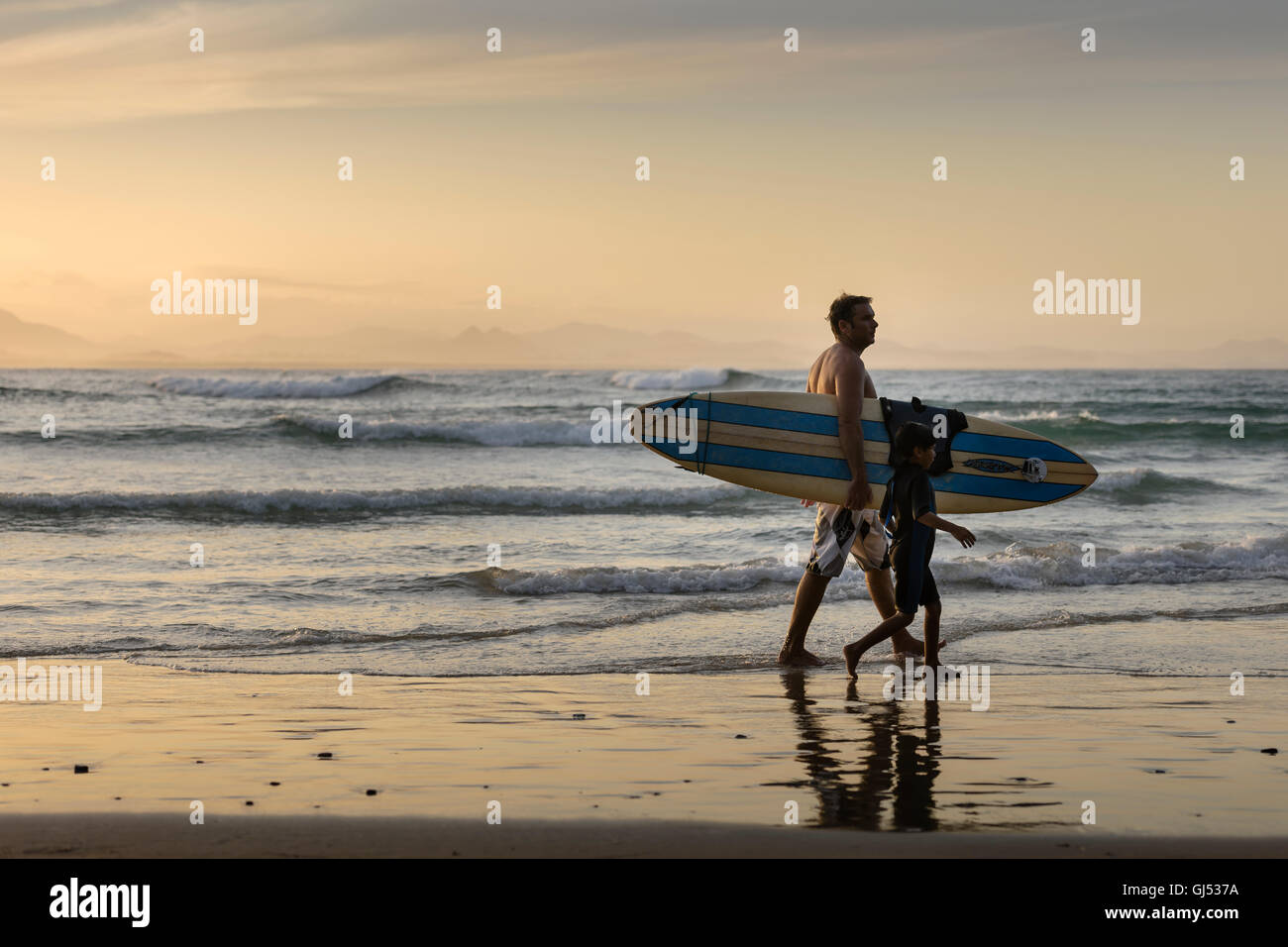 Surfers at Byron Beach in Byron Bay. Stock Photo