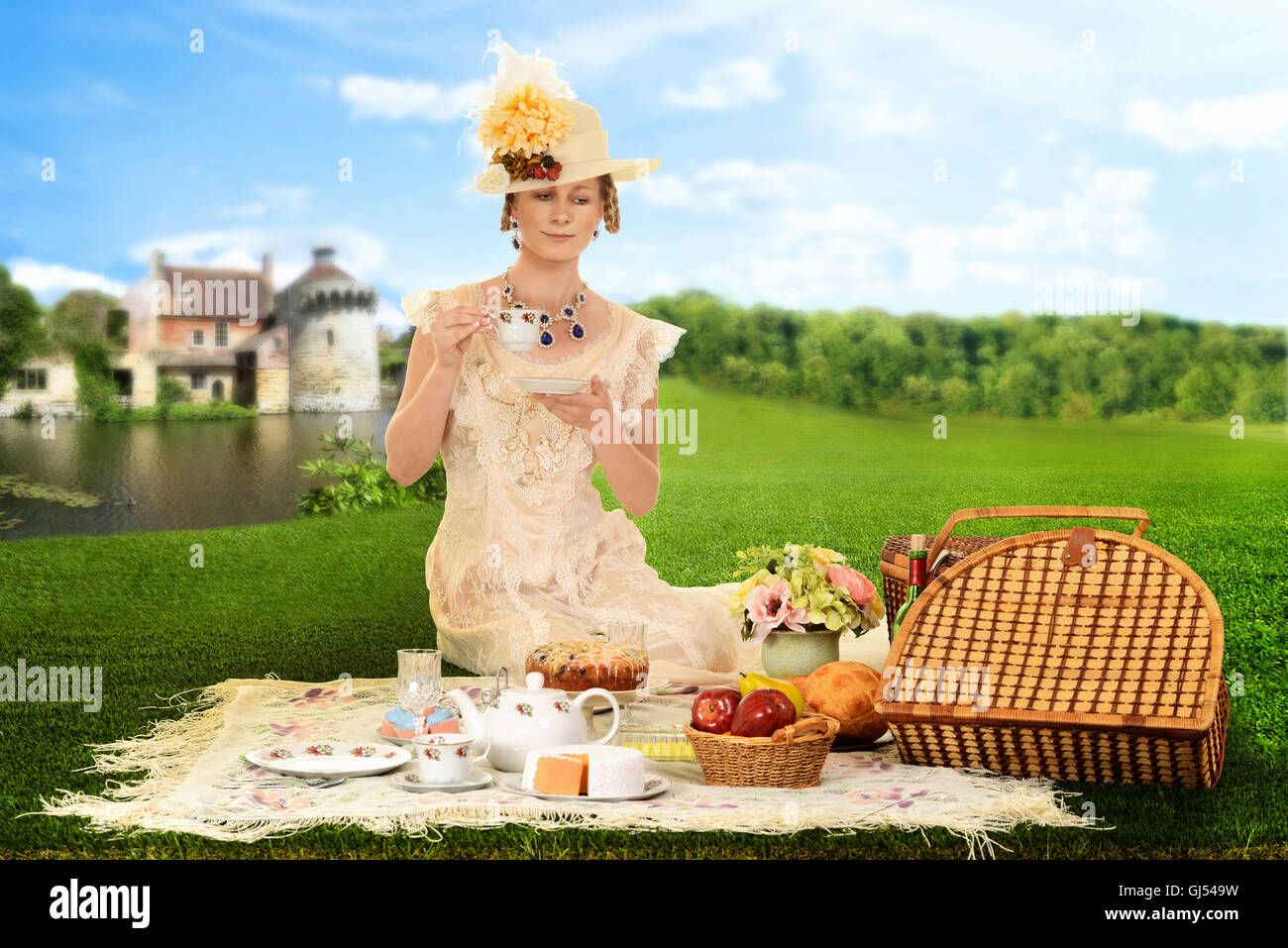 vintage woman picnic by lake Stock Photo