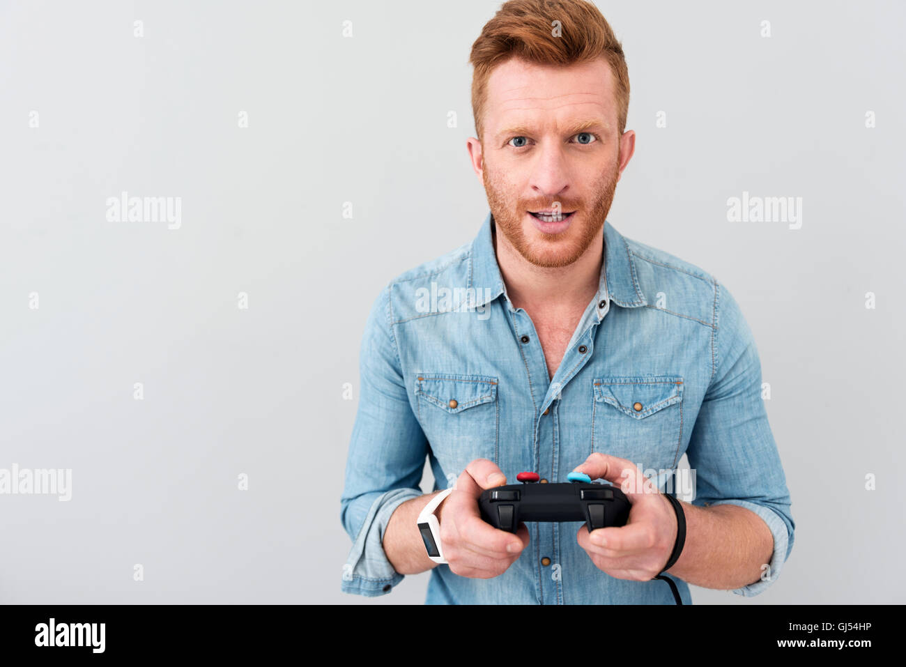 Cheerful man playing video games Stock Photo Alamy
