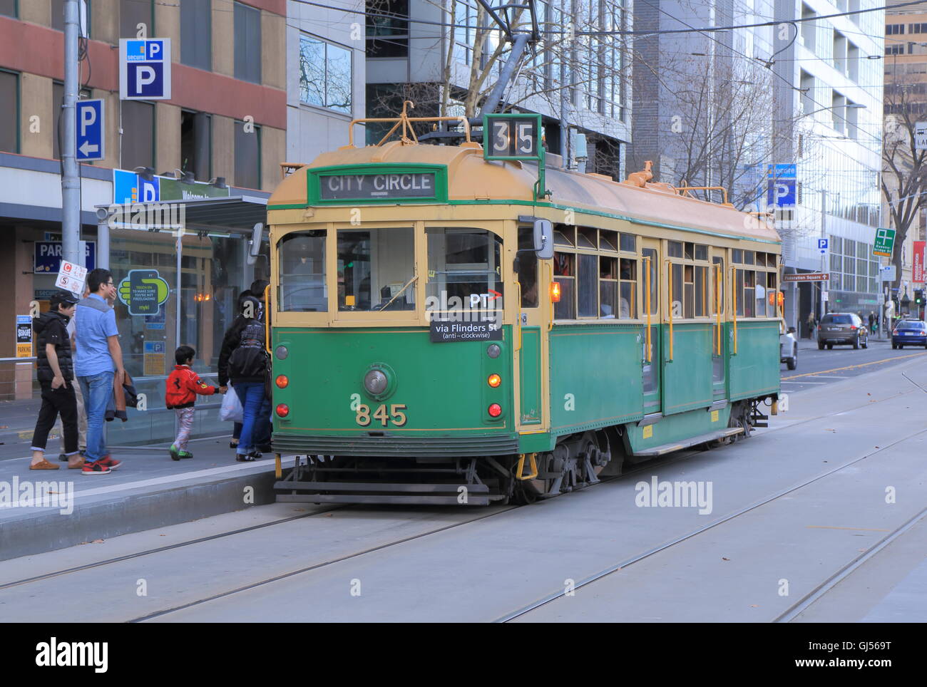 People take historic tram in Melbourne Australia. Stock Photo