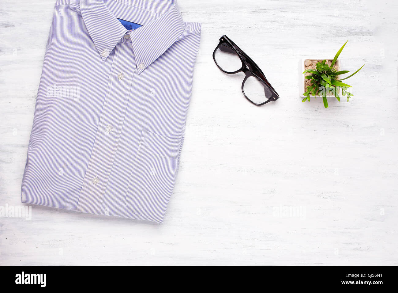 Businessman shirt and hipster glasses on white wooden background. Business and office concept. Lifestyle. Stock Photo
