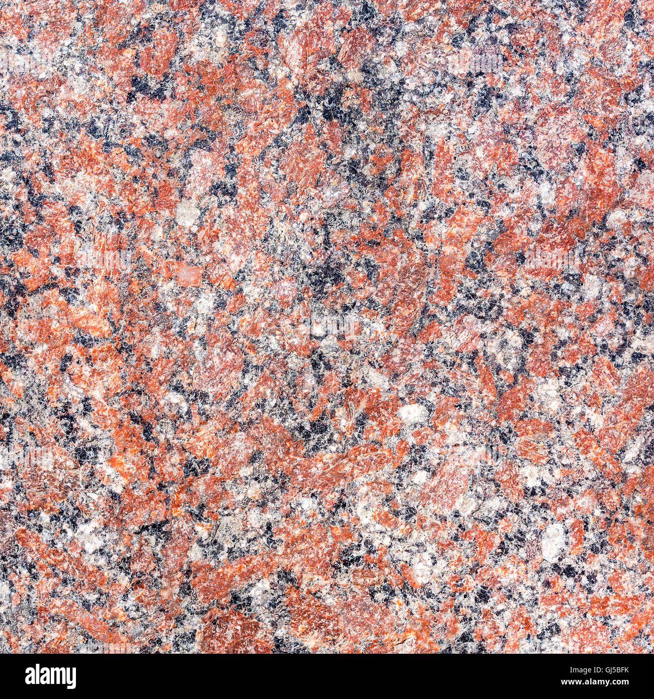 natural red mottled granite texture as background Stock Photo
