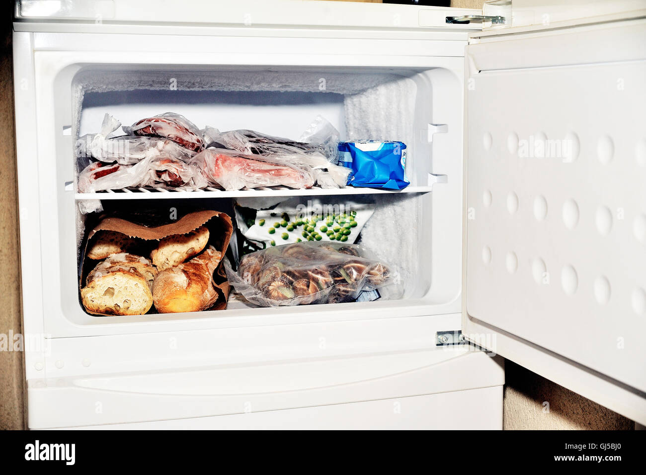 Freezer compartment of a refrigerator containing meat and frozen