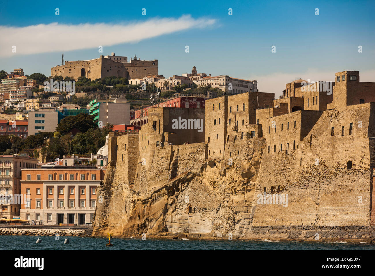 Italy, Naples as seen from the sea. Both castles in one shot: Castel dell'Ovo and Castel Sant'Elmo Stock Photo