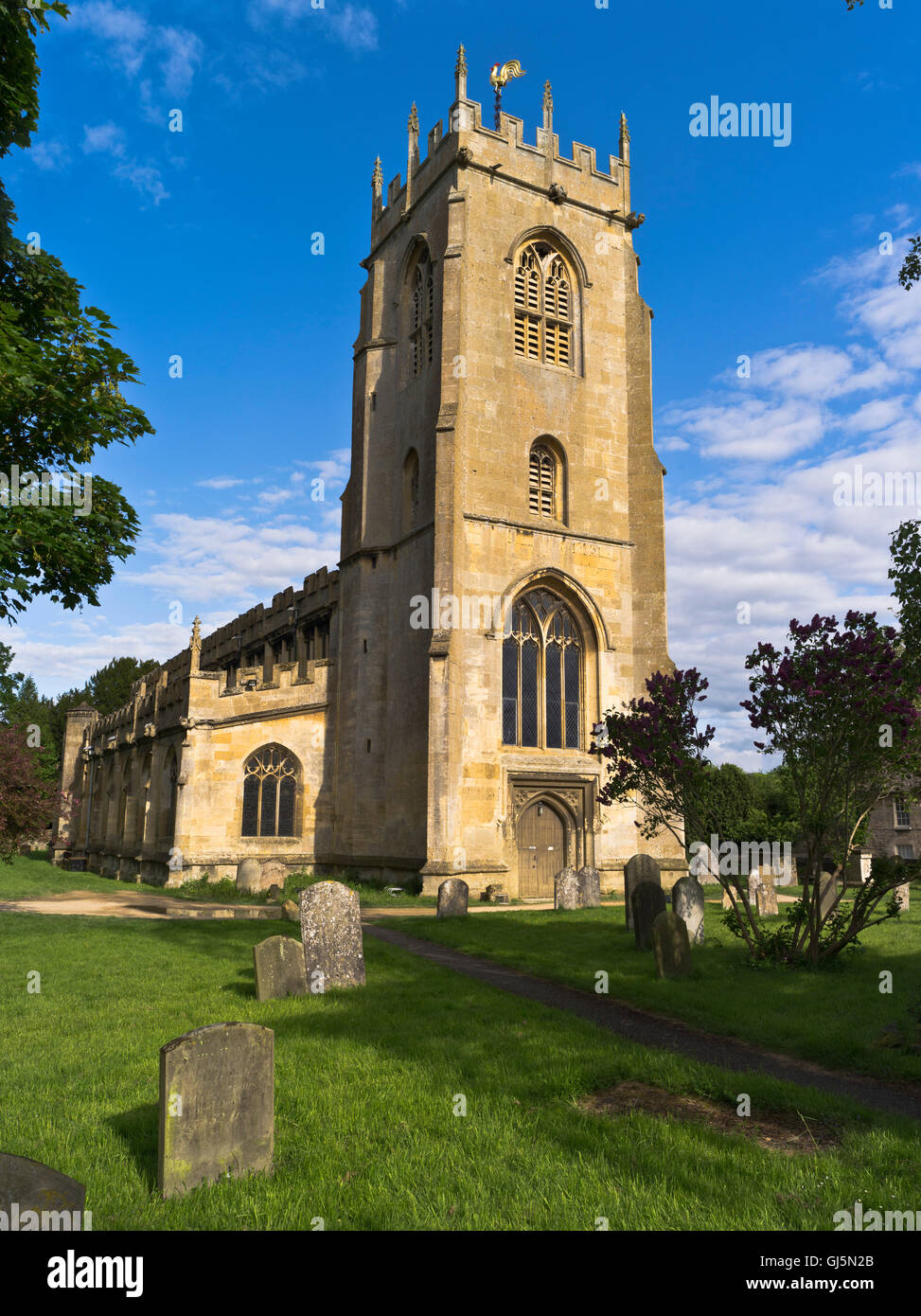 dh St Peters Norman church WINCHCOMBE GLOUCESTERSHIRE Belfry tower churchyard gravestones uk cotswolds village english grave yard Stock Photo
