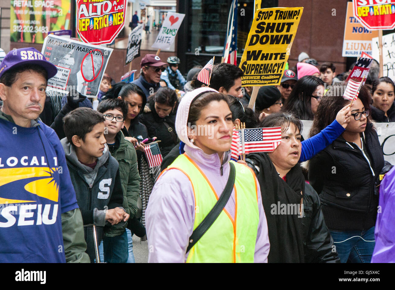 Hundreds of marchers unite on May Day in Chicago to protest Donald Trump's anti immigrant rhetoric. Stock Photo