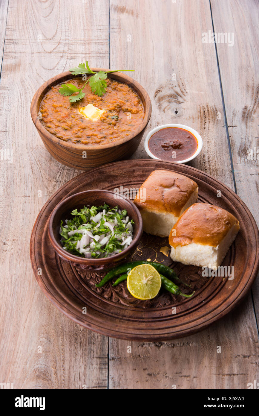 Pav Bhaji or paav bhaji, Indian spicy fast food with bread, onion and