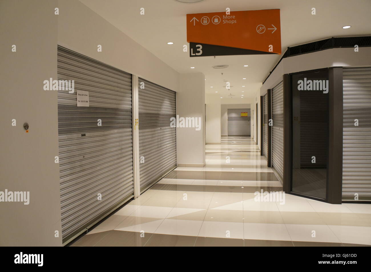 unoccupied and vacant shop lots in a shopping mall in Kuala Lumpur, Malaysia Stock Photo