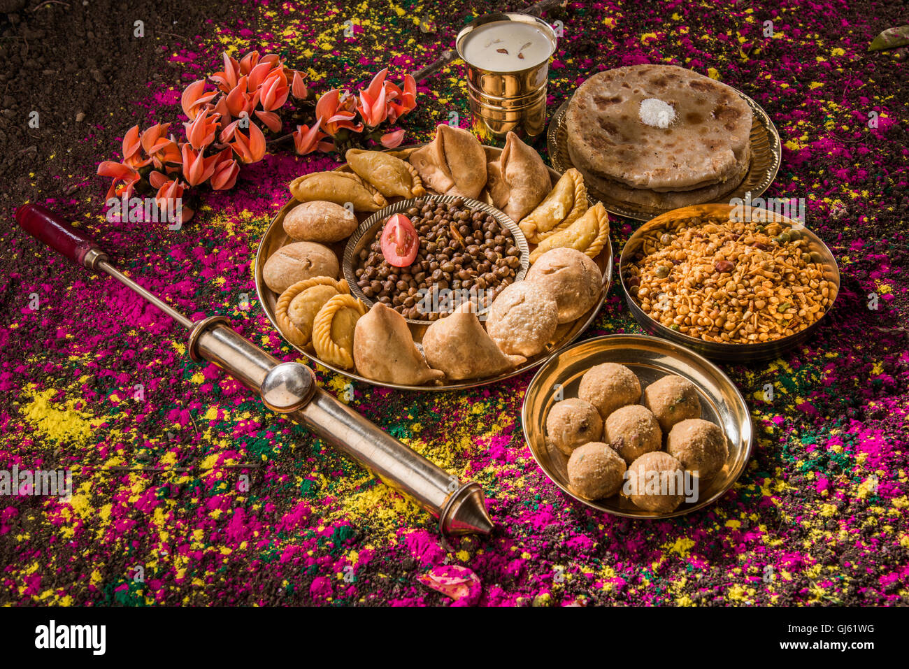 holi festival food with colours, indian festival holi, samosa, kachori