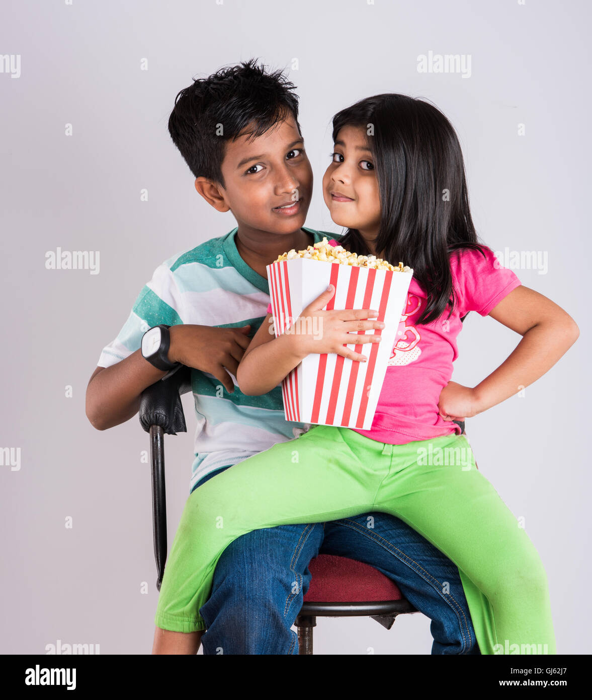 Indian Cute Girl And Boy Eating Popcorn Asian Kids And Popcorn Little Girl And Little Boy Enjoy Eating Popcorn And Tv Indian Cute Girl And Boy Eating Popcorn Asian Kids And Popcorn Little Girl And Little Boy Enjoy Eating Popcorn And Tv