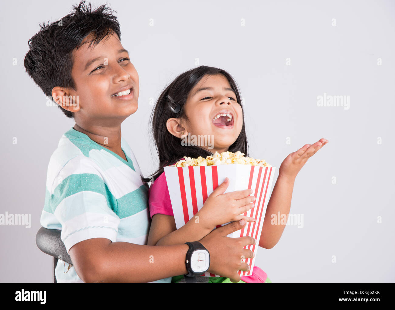 Indian Cute Girl And Boy Eating Popcorn Asian Kids And Popcorn Little Girl And Little Boy Enjoy Eating Popcorn And Tv Indian Cute Girl And Boy Eating Popcorn Asian Kids And Popcorn Little Girl And Little Boy Enjoy Eating Popcorn And Tv