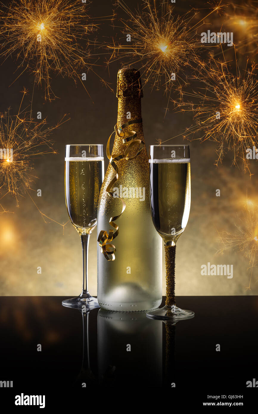 Champagne bottle and champagne glass in holiday setting Stock Photo Alamy