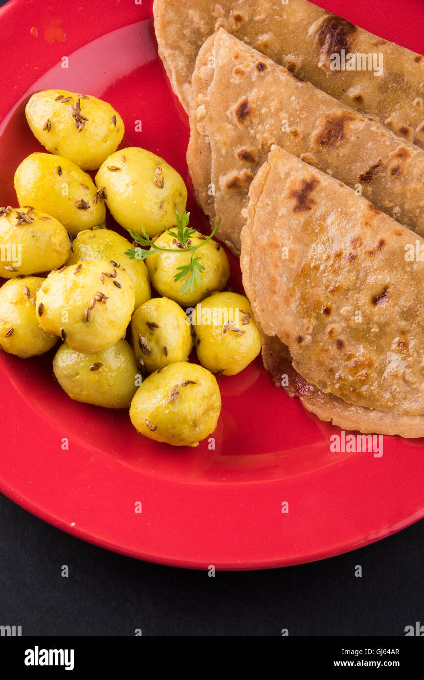 aloo fry or dry potato curry with chapati or roti or indian bread Stock