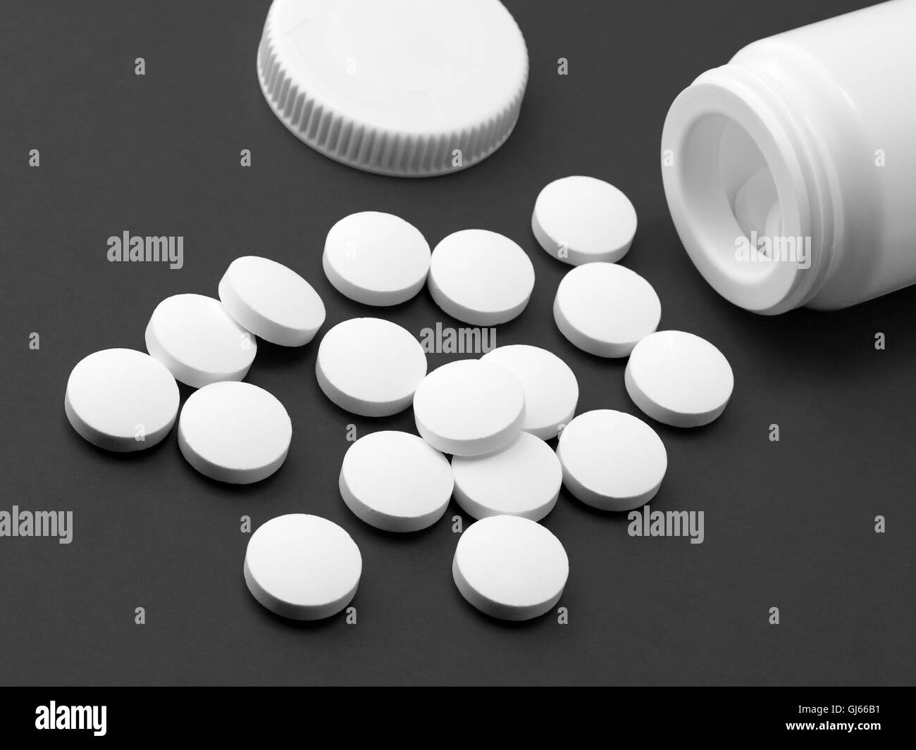 Black and white pills Stock Photo Alamy