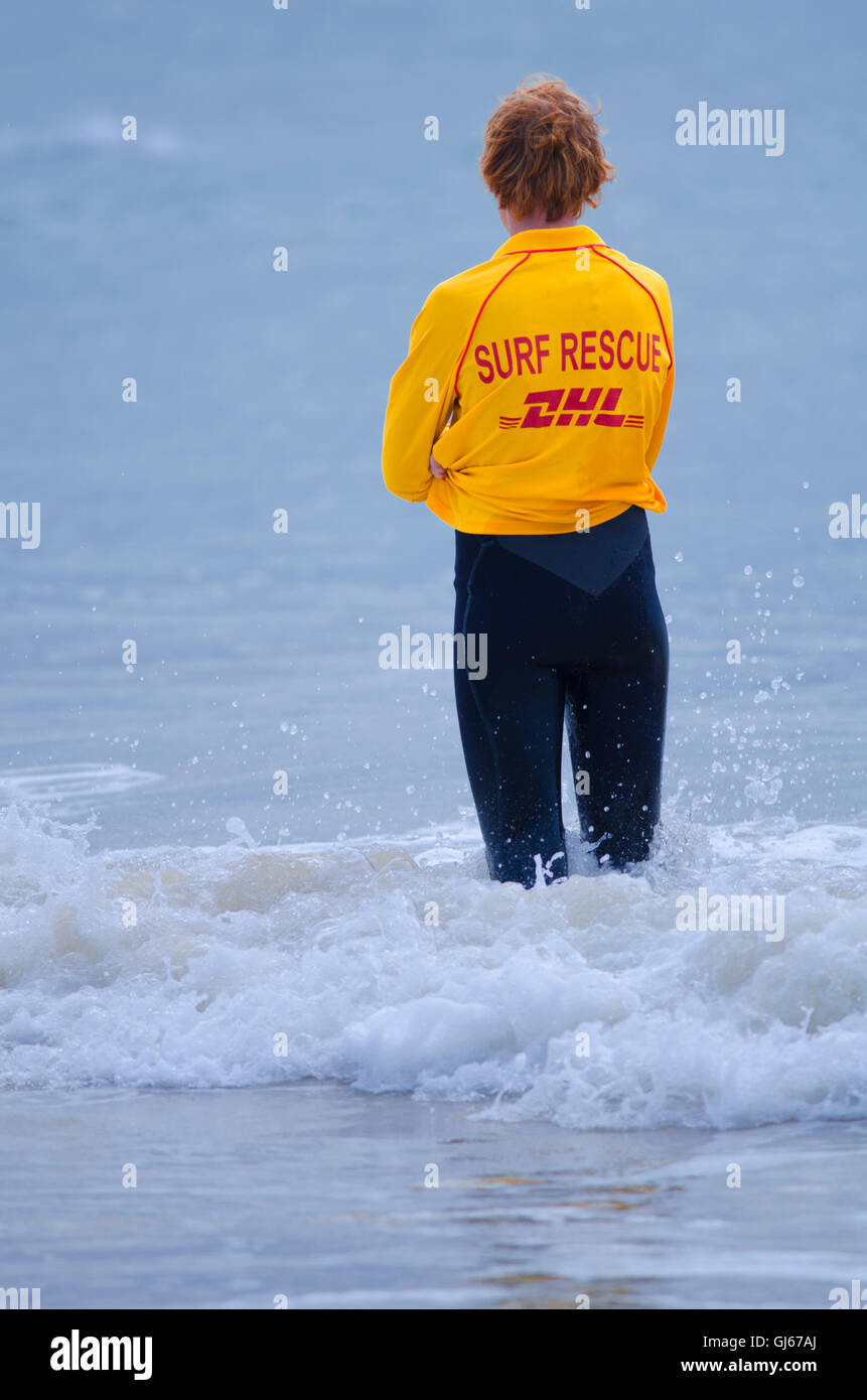 Australian Surf Lifesaving member patrolling beach Stock Photo