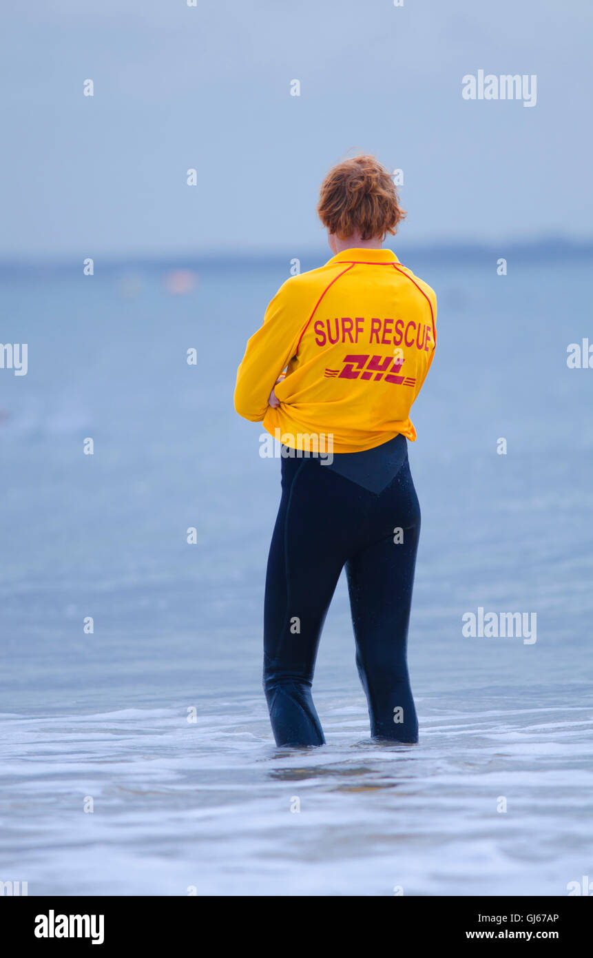 Australian Surf Lifesaving member patrolling beach Stock Photo