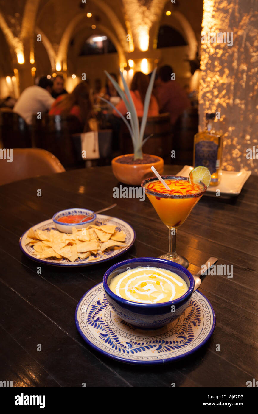 Corn soup with a fresh mango margarita in La Taberna restaurant at La Cofradía hacienda in Tequila, Jalisco, Mexico. Stock Photo