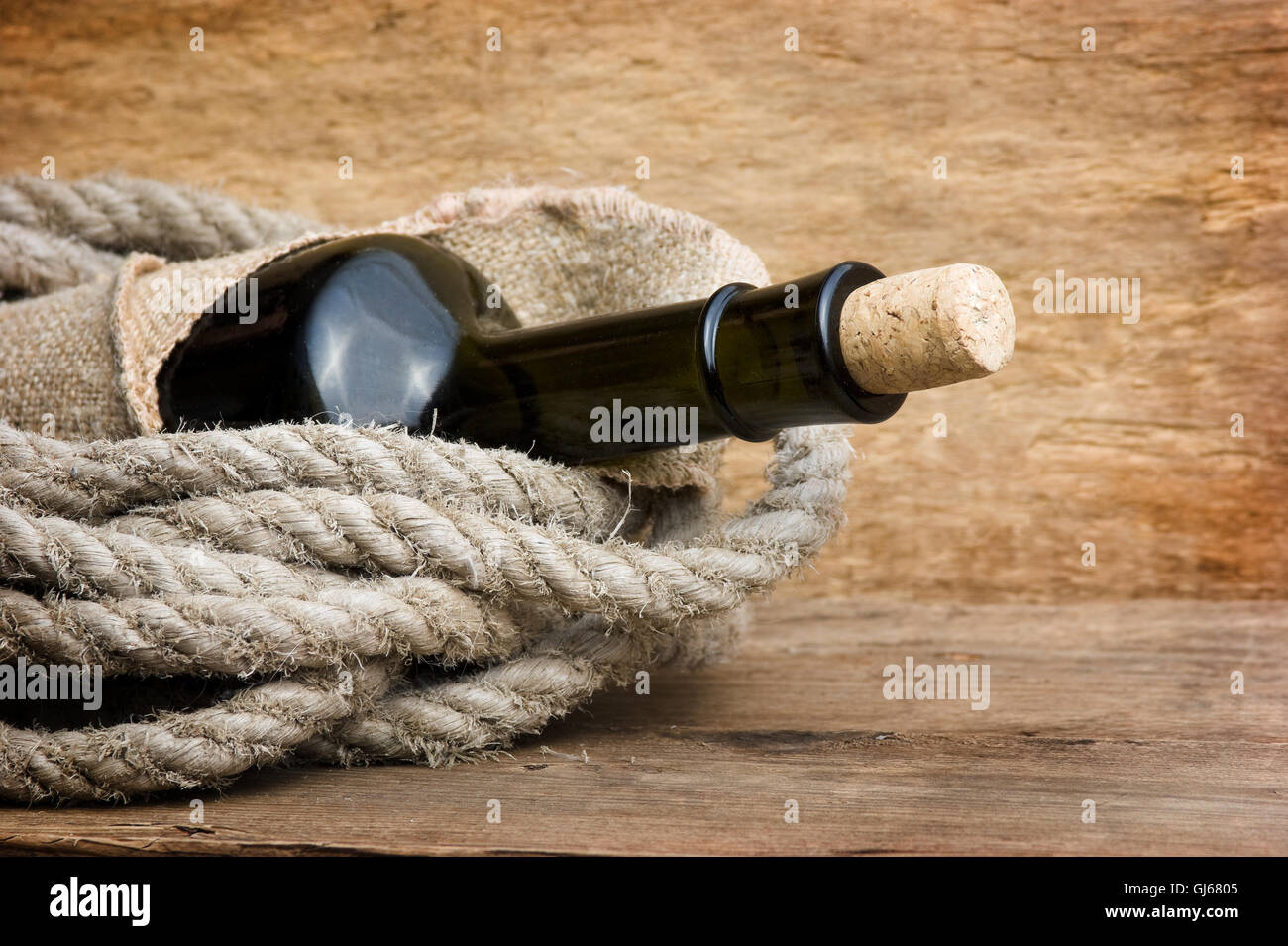 bottle wrapped with rope Stock Photo - Alamy