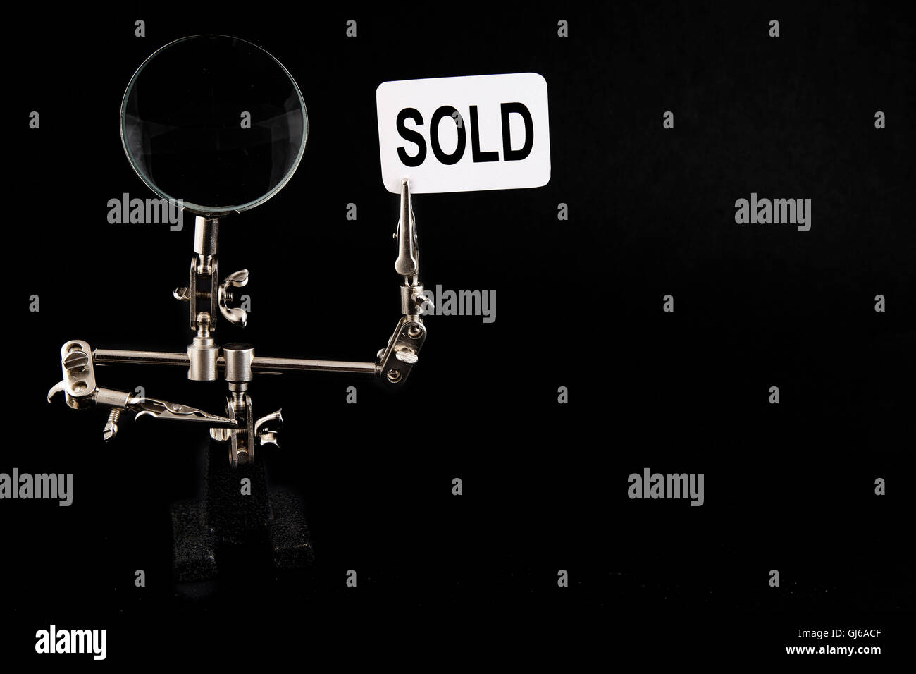 figure of steel man with "sold" inscription Stock Photo Alamy