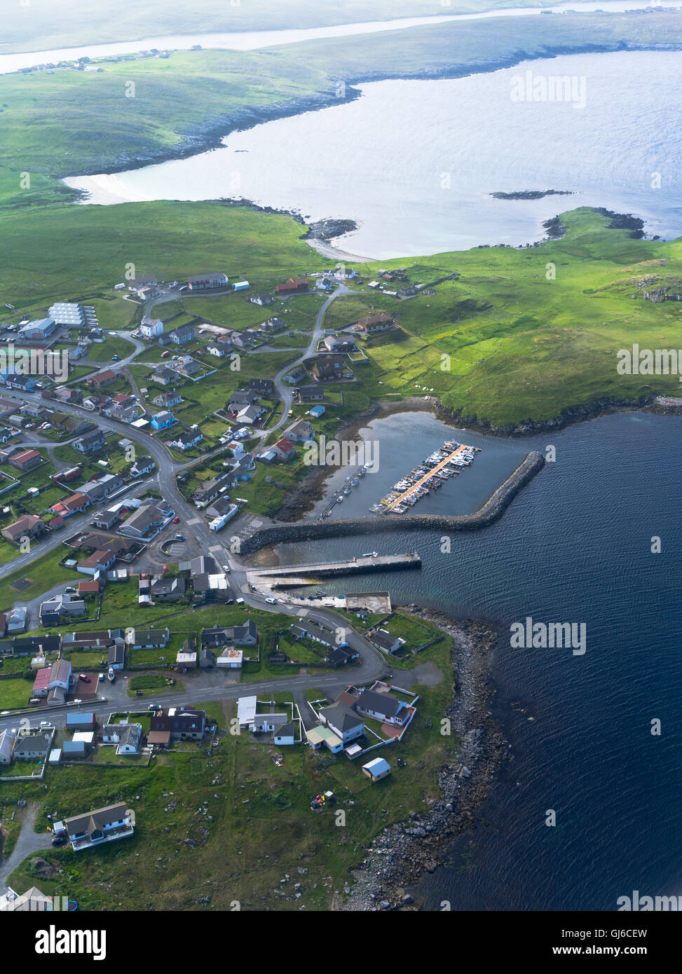 dh HAMNAVOE SHETLAND Aerial view of Hamna Voe pier marina Shetland coast harbour scotland Stock