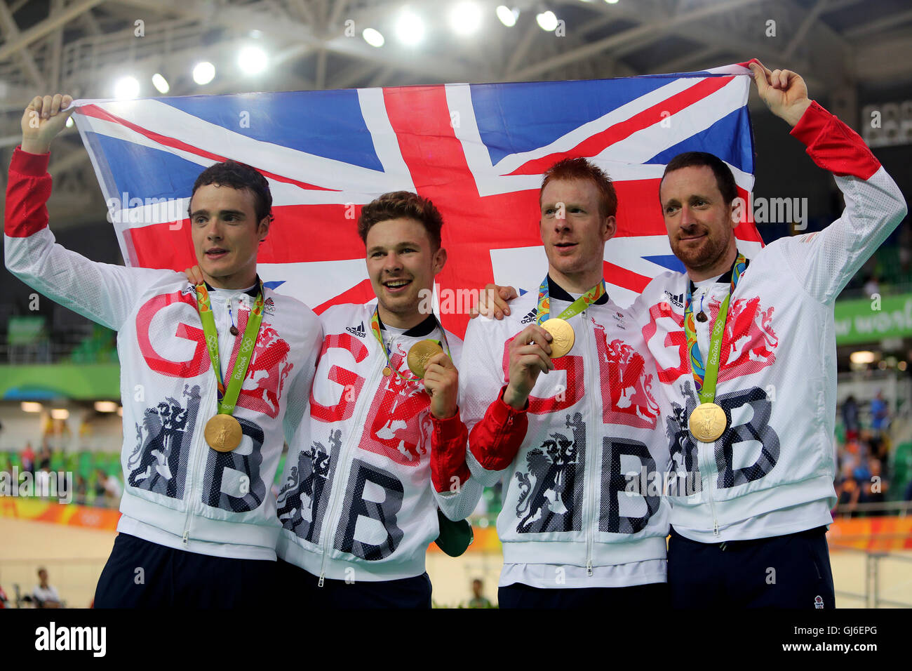 Great Britain's (left-right) Steven Burke, Owain Doull, Ed Clancy and Sir Bradley Wiggins with their gold medals following victory in the men's team pursuit final on the seventh day of the Rio Olympics Games, Brazil. Stock Photo