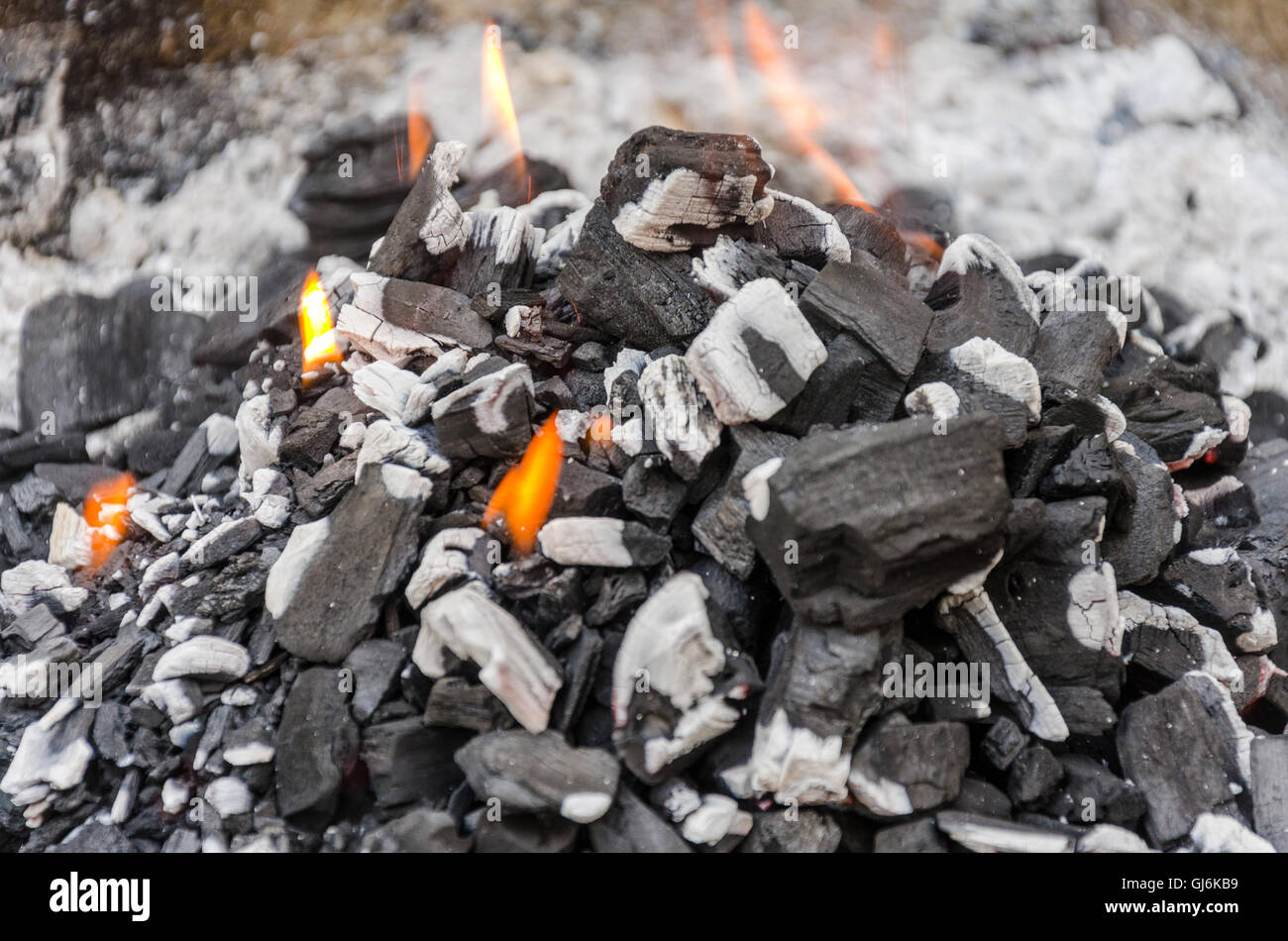 Charcoal in a barbeque ablaze. Stock Photo