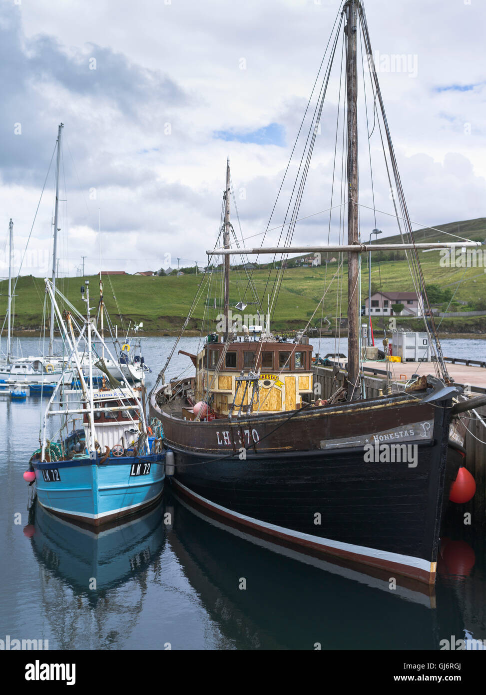 dh Harbour VOE SHETLAND shetland bus honestas fishing vessels berth pier boat Stock Photo