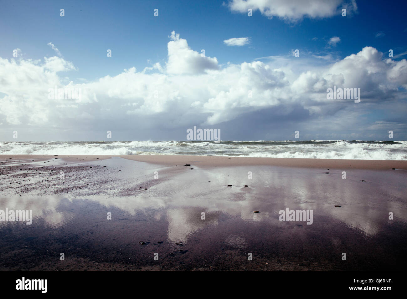 beach of the North Sea with thunderclouds Stock Photo