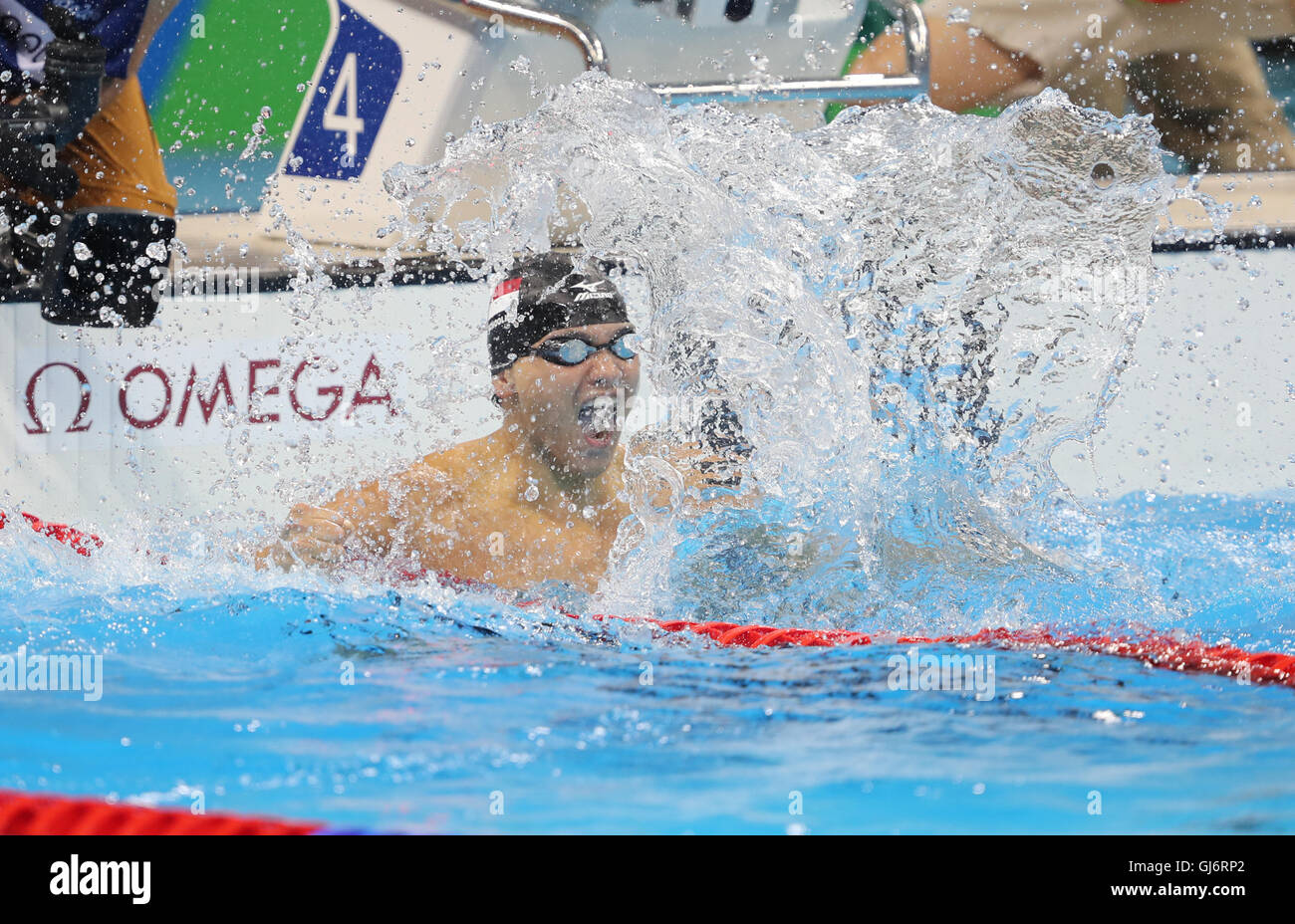 Singapore's Joseph Schooling celebrates winning the Men's 100m Butterfly Final at the Olympic Aquatics Stadium on the seventh day of the Rio Olympic Games, Brazil. Stock Photo