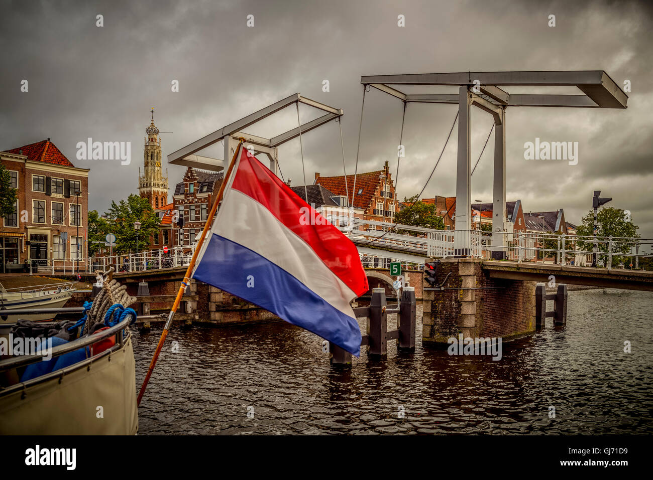 The Netherlands, Haarlem, canal, flag Stock Photo
