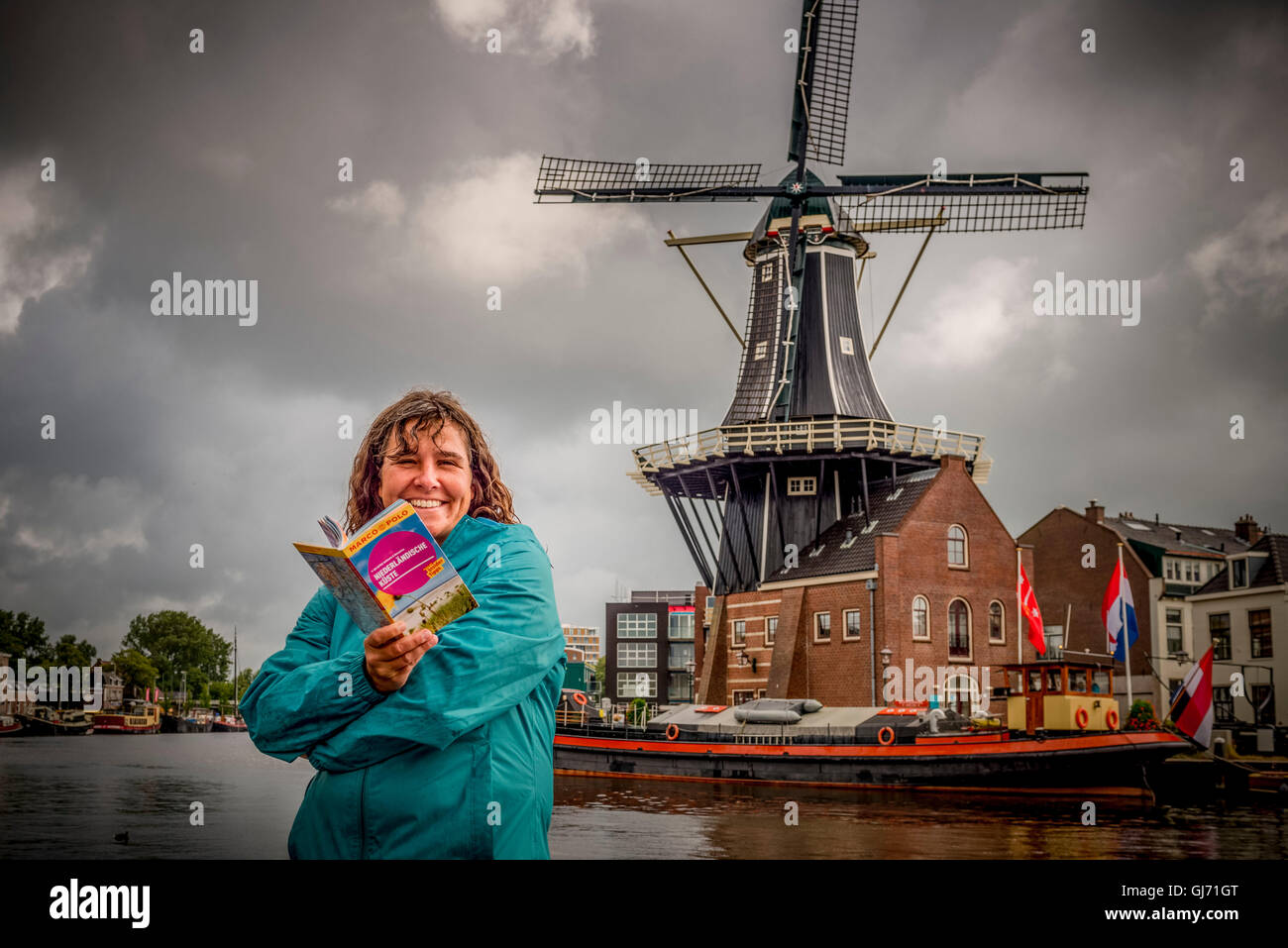 The Netherlands, Haarlem, mill, windmill, De Adriaan, person, woman with guide Stock Photo